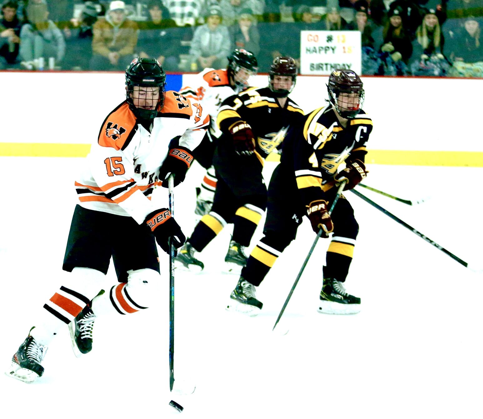 Aiden Kronebusch brings the puck up the ice
